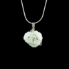 Solar Quartz stalactite slice pendant minimally wrapped in .935 Argentium Silver wire and shown on a silver snake chain on a black background. The stone is white with irregular edges and it has several green moss inclusions.