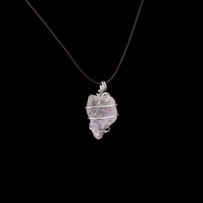 140 carat ametrine raw stone wrapped in hammered aluminum wire. This pendant is shown with a leather cord, but it is available with a silver chain if preferred.