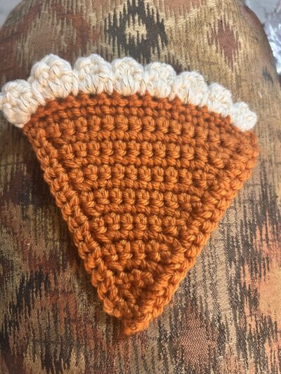 pumpkin pie shaped coaster, topped with whipped cream!
