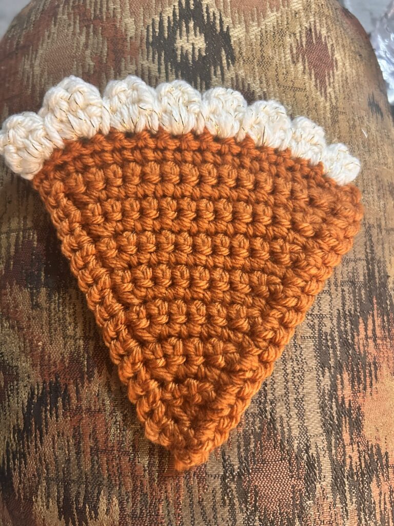 pumpkin pie shaped coaster, topped with whipped cream!