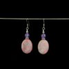 Rhodonite and Amethyst genuine gemstone earrings accented with small Tibetan Silver saucer beads. These earrings feature .925 Sterling Silver French ear wires.