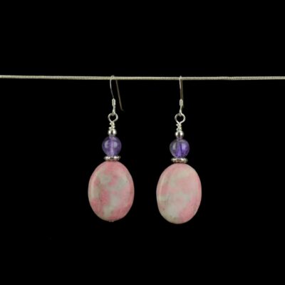 Rhodonite and Amethyst genuine gemstone earrings accented with small Tibetan Silver saucer beads. These earrings feature .925 Sterling Silver French ear wires.
