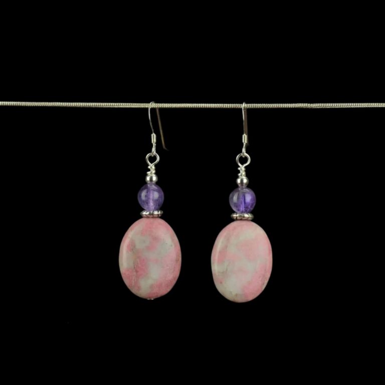 Rhodonite and Amethyst genuine gemstone earrings accented with small Tibetan Silver saucer beads. These earrings feature .925 Sterling Silver French ear wires.