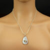 Pendant is shown on a mannequin.