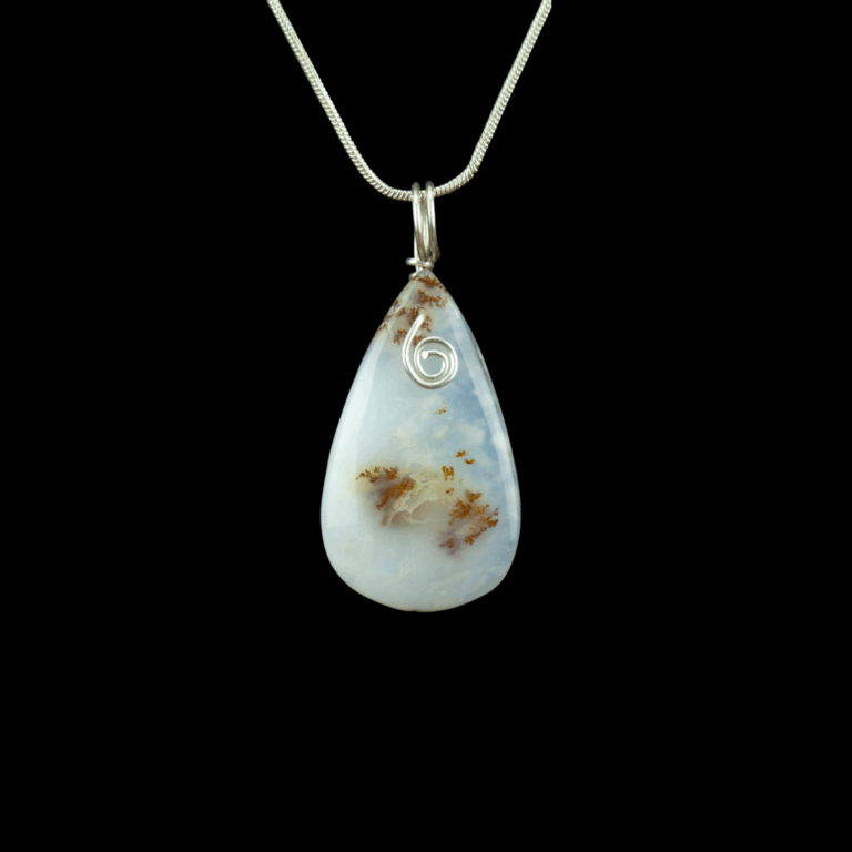 Turkish dendritic opal teardrop stone with a small swirl and a silver bail. This pendant hangs from a silver snake chain.