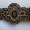 Brocade belt buckle close up