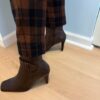 Brown boots on model side heels
