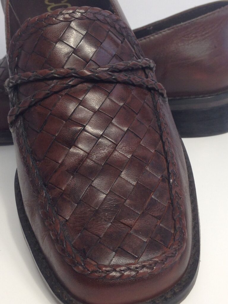 Brown loafers close up woven detail