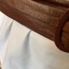 Bronze belt shows wear on buckle