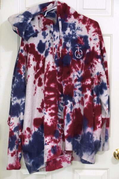A red, white, and blue tie-dyed two piece sweat suit. Crumple pattern. Oversized XL.