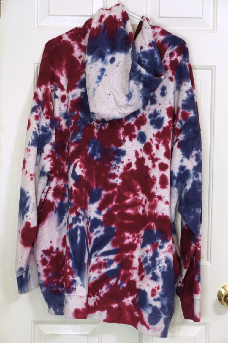 A red, white, and blue tie-dyed two piece sweat suit. Crumple pattern. Oversized XL.