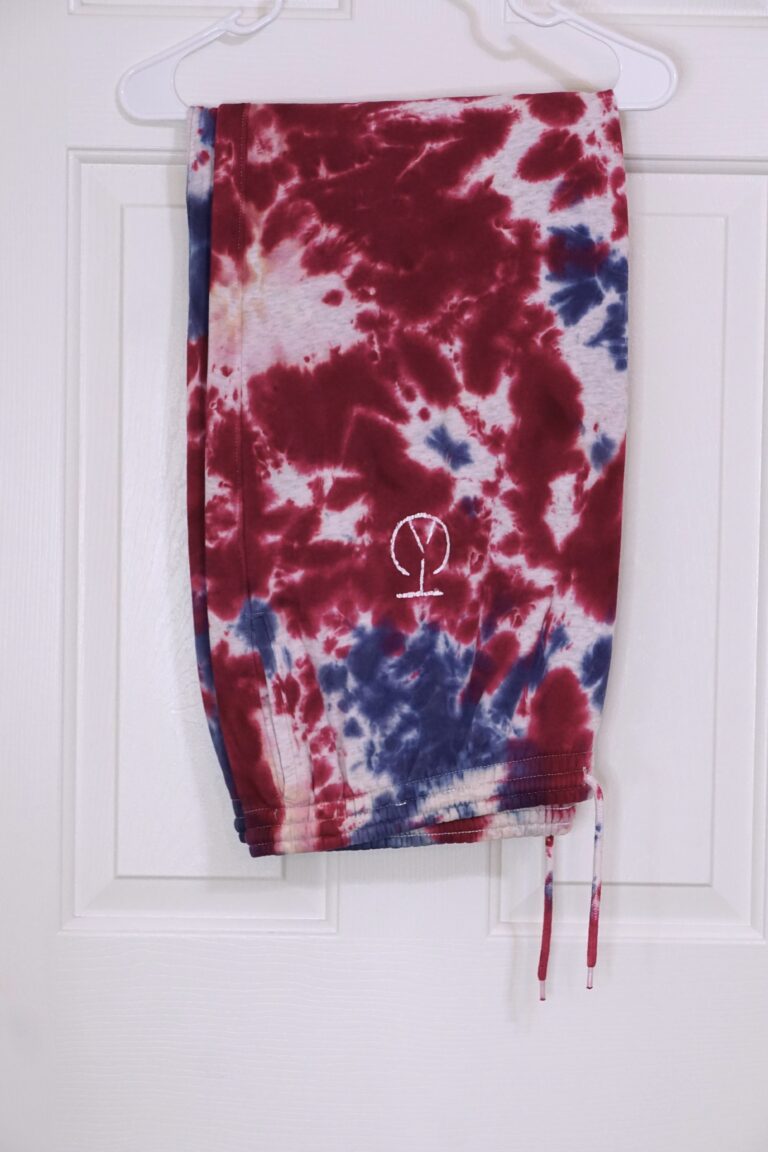 A red, white, and blue tie-dyed two piece sweat suit. Crumple pattern. Oversized XL.