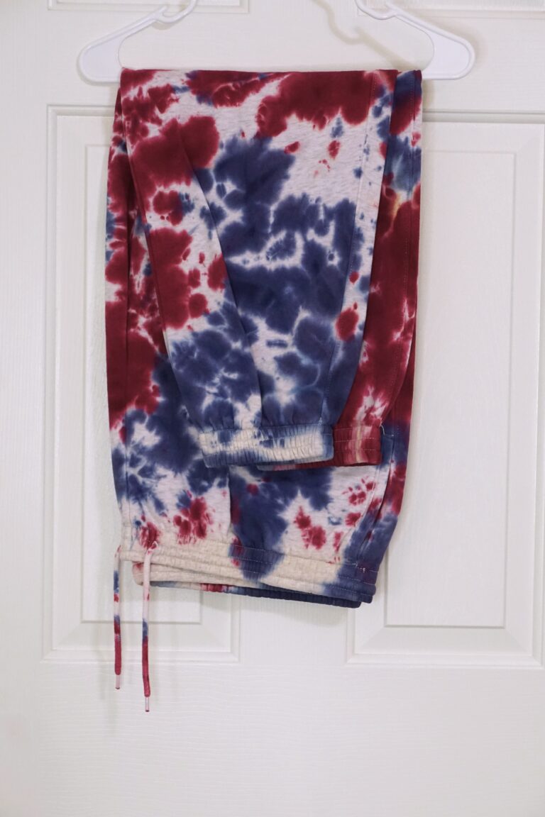 A red, white, and blue tie-dyed two piece sweat suit. Crumple pattern. Oversized XL.