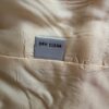 Yellow suit dry clean tag