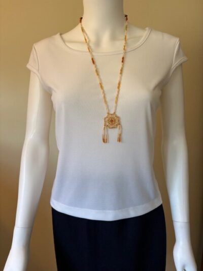 Yellow necklace on model