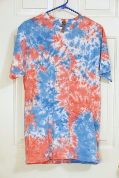 A pink and blue tie-dye shirt in a crumple pattern. Large.