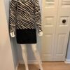 Zebra top suede skirt red mules on model