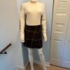 Armani skirt on model with turtleneck and shoes