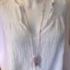 Pastel necklace on different top
