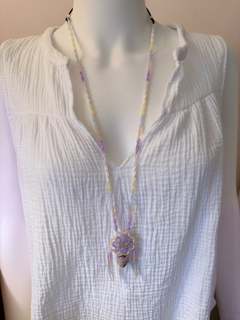 Pastel necklace on different top