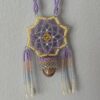 Pastel necklace close up shield