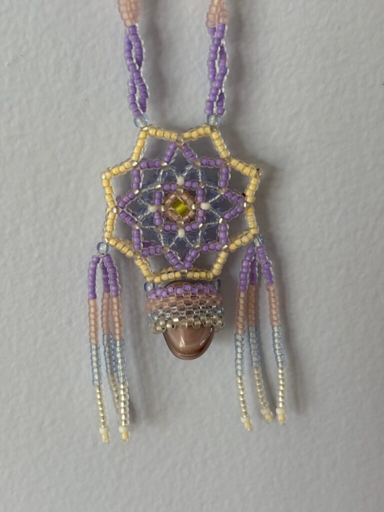 Pastel necklace close up shield