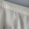 Limited top stitched shoulder