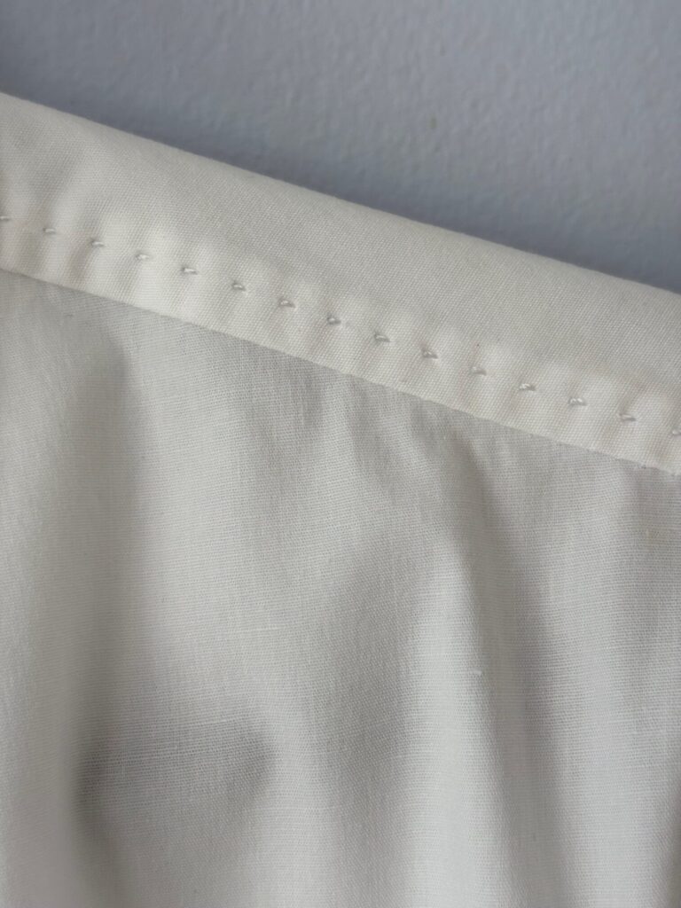 Limited top stitched shoulder
