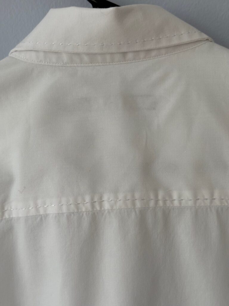 Limited top stitched back yoke