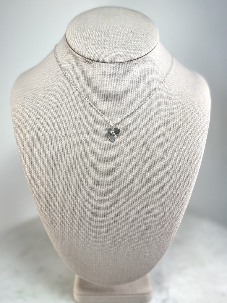Sterling Silver Flower pendant Necklace on linen bust