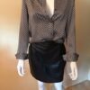 Leather skirt blouse on model