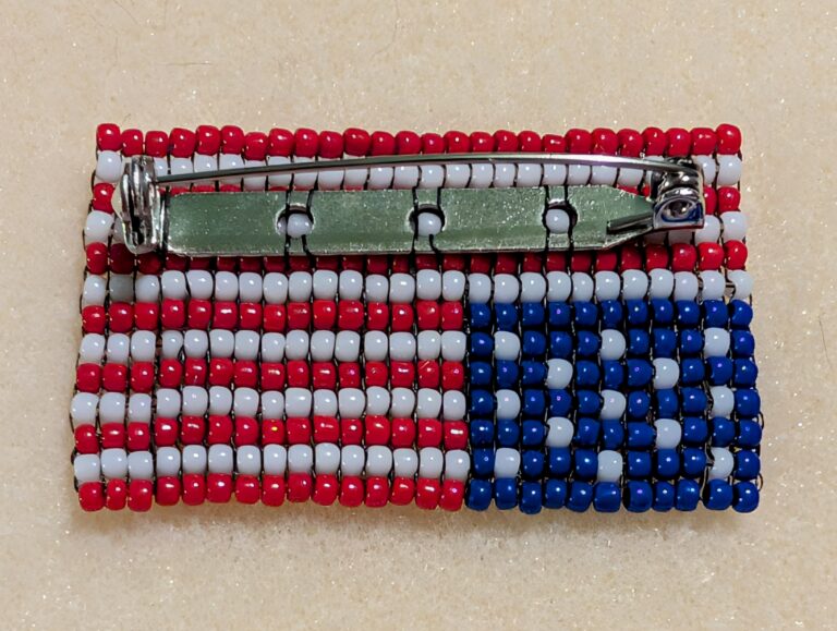 The back of the beaded distress flag pin.