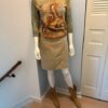 Tan skirt tee and boots on model