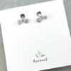 sterling silver orchid flower stud earrings on card