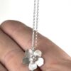 Sterling Silver Wild Rose Flower pendant Necklace on hand