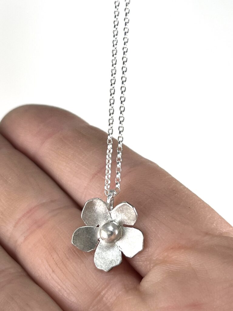 Sterling Silver Wild Rose Flower pendant Necklace on hand