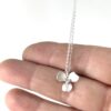 Sterling Silver Orchid Flower pendant Necklace on hand