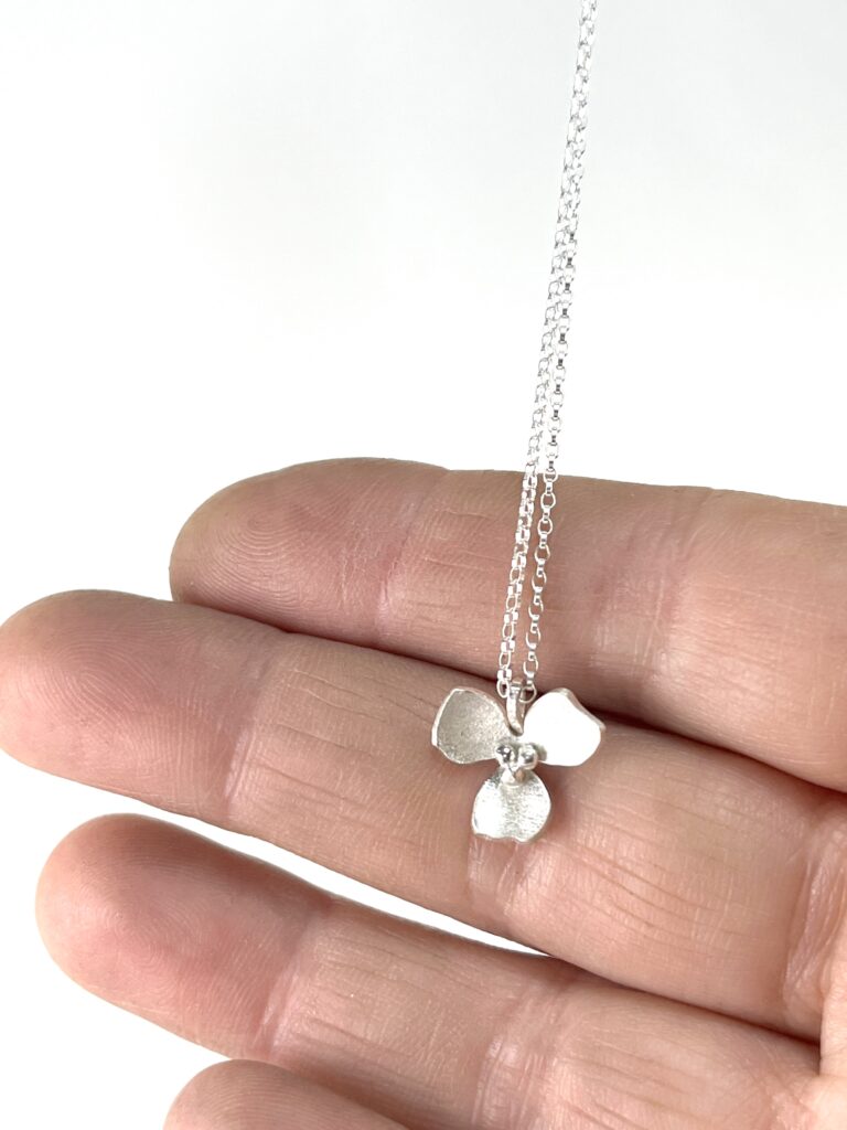 Sterling Silver Orchid Flower pendant Necklace on hand