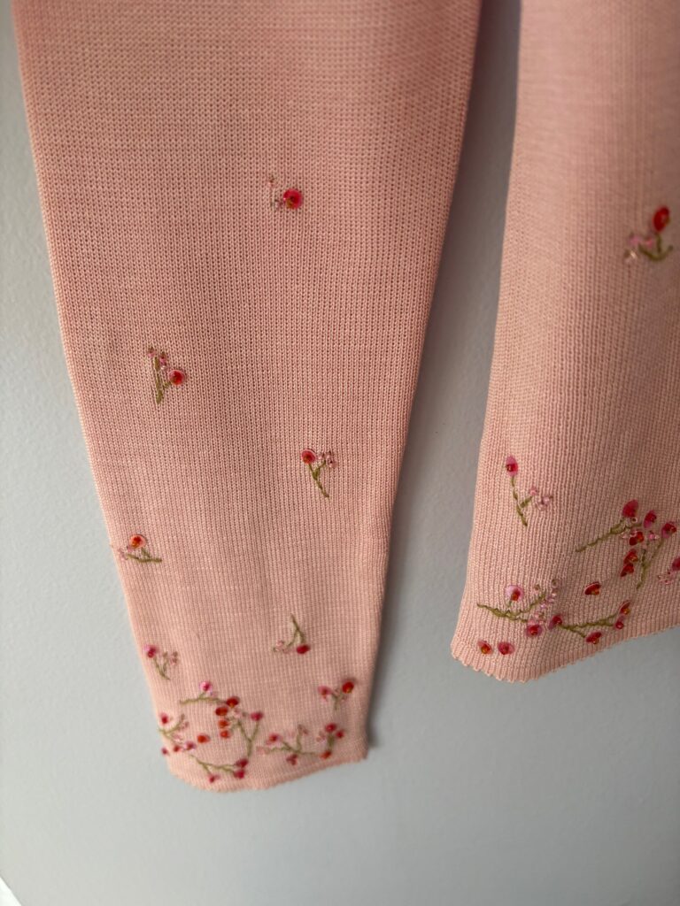 Pink Sweater set embroidery on sleeve close up