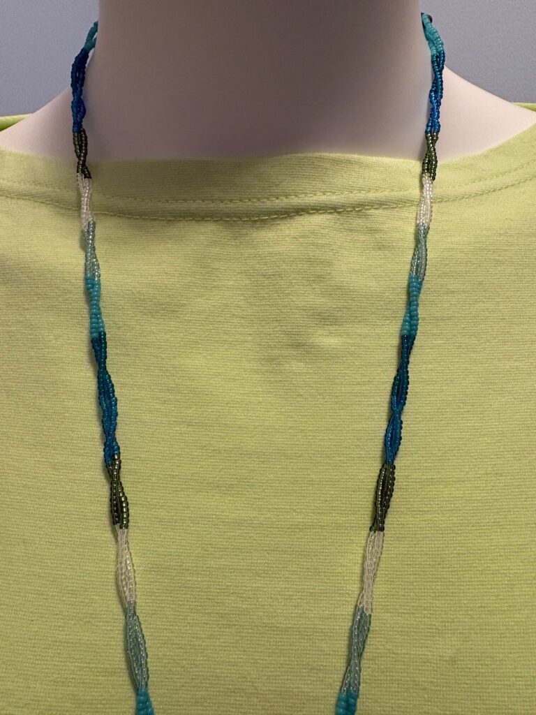 Glass Seed Bead Shield Style Necklace 8 Blue lace strands green tee