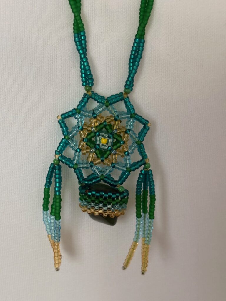 Glass Seed Bead Shield Style Necklace 2 Dark Green stone close up