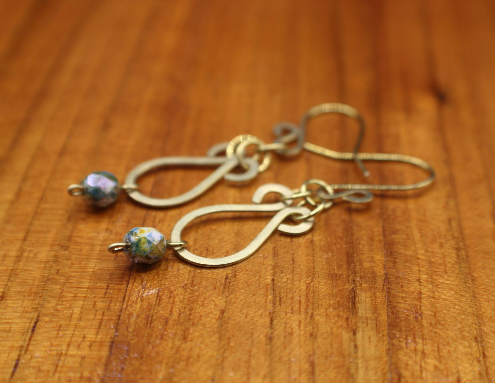 Hammered brass earrings with Picasso finish Czech beads