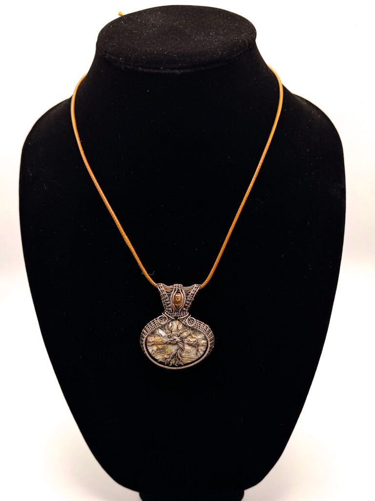 Vibrant Spirit Wire Wrapped Crazy Lace Agate Tree of Life Necklace 2 Photo of Vibrant Spirit Wire Wrapped Crazy Lace Agate Tree of Life Pendant on a necklace display