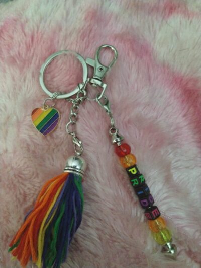 Custom Pride Keychain with rainbow letter beads spelling PROUD on a silver clasp.
