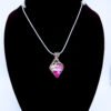 Photo of Tranquil Energy Wire Wrapped White Plume Agate Pendant on a neck form