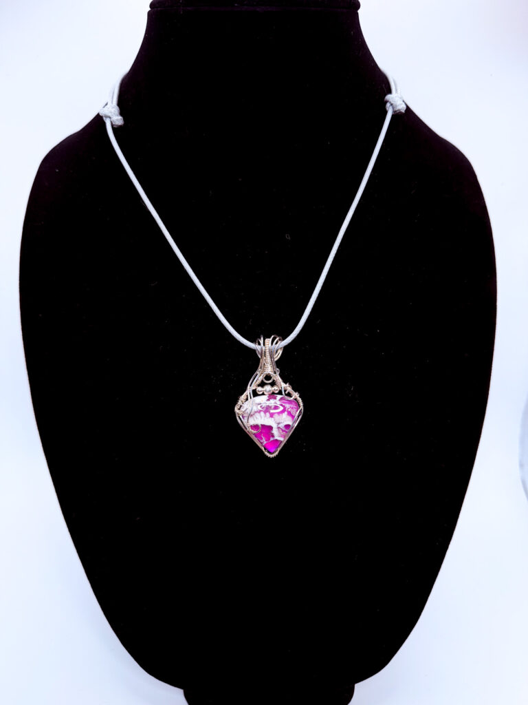 Photo of Tranquil Energy Wire Wrapped White Plume Agate Pendant on a neck form