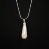 Rose quartz pendant with a silver snake chain.