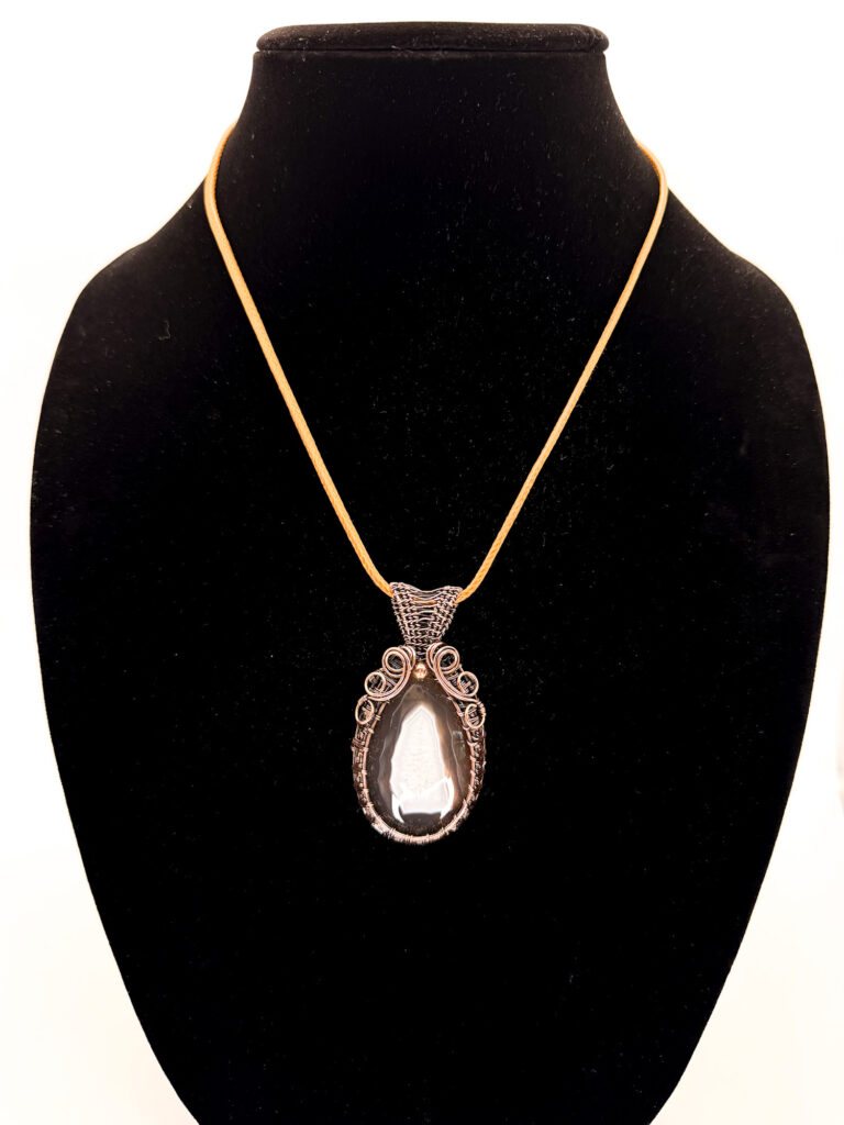 Nurturing Light Wire Wrapped Botswana Agate Necklace 6 Photo of Healing Grace Wire Wrapped Botswana Agate Necklace. on a neck form