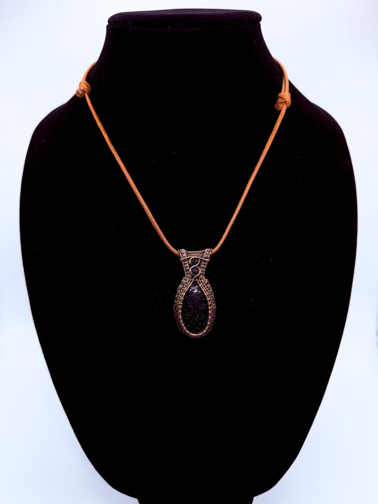 Radiant Night Wire Wrapped Blue Goldstone Necklace 6 Photo of Radiant Night Wire Wrapped Blue Goldstone Necklace on a neck form