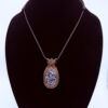 Photo of Spiritual Calm Wire Wrapped Pinolith Jasper Necklace on a neck form